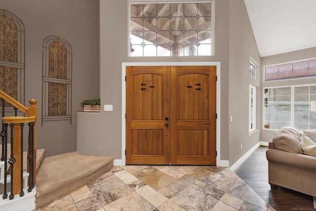 entryway with a high ceiling