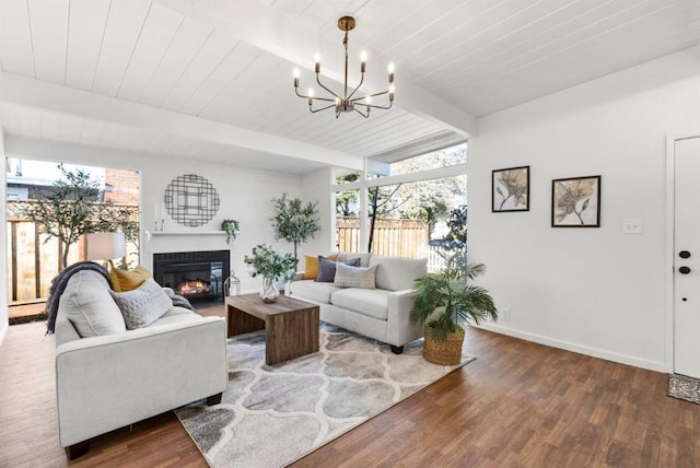 living room featuring beam ceiling, expansive windows, a chandelier, and hardwood / wood-style flooring