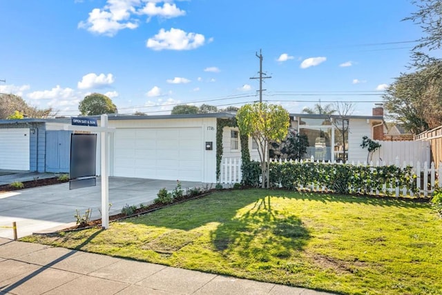 single story home with a front lawn and a garage