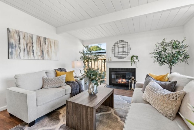 living room with beamed ceiling, dark hardwood / wood-style flooring, and wooden ceiling