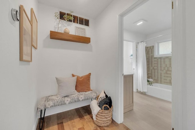 interior space featuring shower / bath combo and wood-type flooring