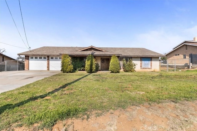 ranch-style house with concrete driveway, an attached garage, a front lawn, and fence