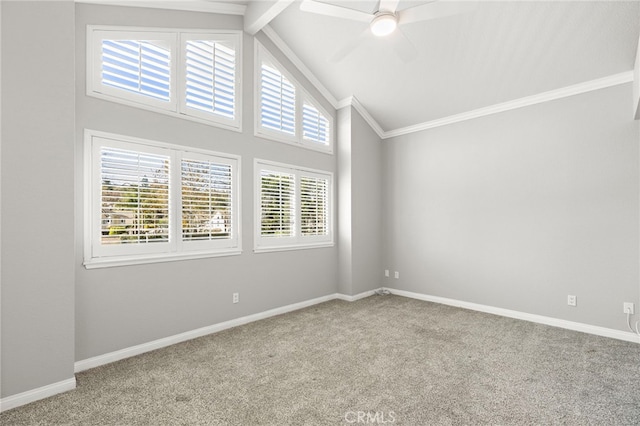 spare room featuring ceiling fan, light colored carpet, and vaulted ceiling with beams