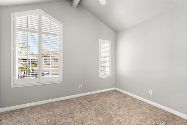 unfurnished room featuring vaulted ceiling with beams and carpet flooring