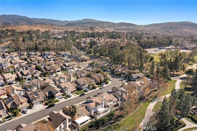 birds eye view of property featuring a mountain view