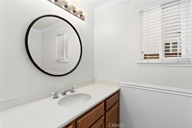 bathroom featuring crown molding and vanity