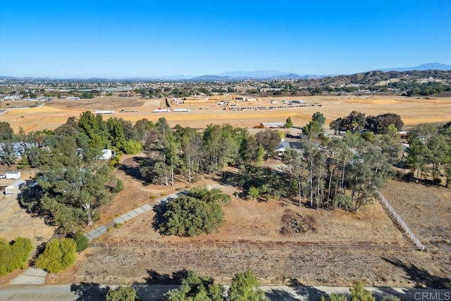 bird's eye view featuring a rural view and a mountain view