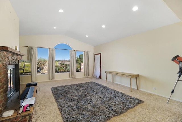 carpeted living room featuring a fireplace and lofted ceiling