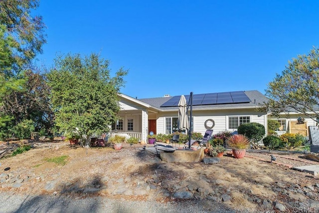 back of house with solar panels