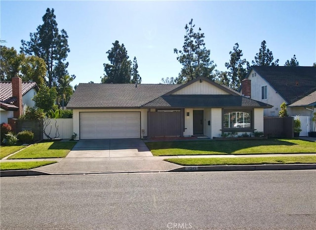 view of front facade featuring a front lawn and a garage