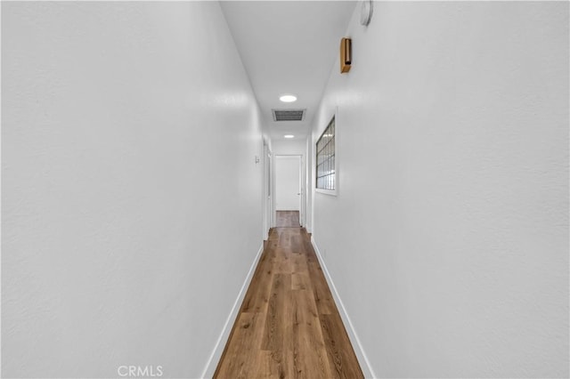 corridor featuring hardwood / wood-style flooring