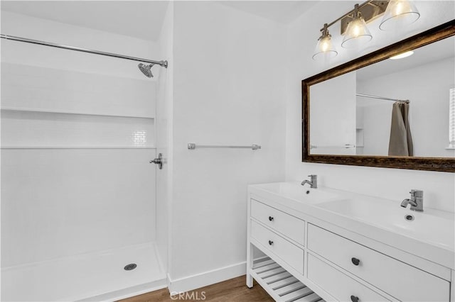 bathroom featuring vanity, hardwood / wood-style floors, and a shower with shower curtain