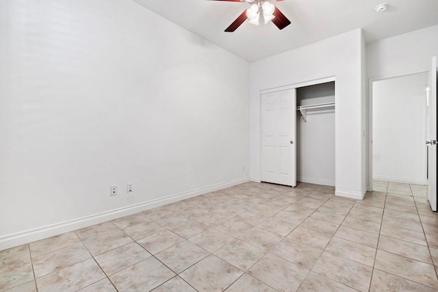 unfurnished bedroom featuring ceiling fan, a closet, and light tile patterned floors