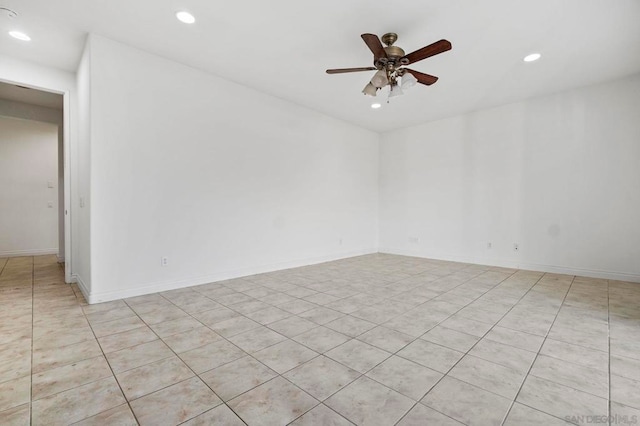 tiled empty room with ceiling fan