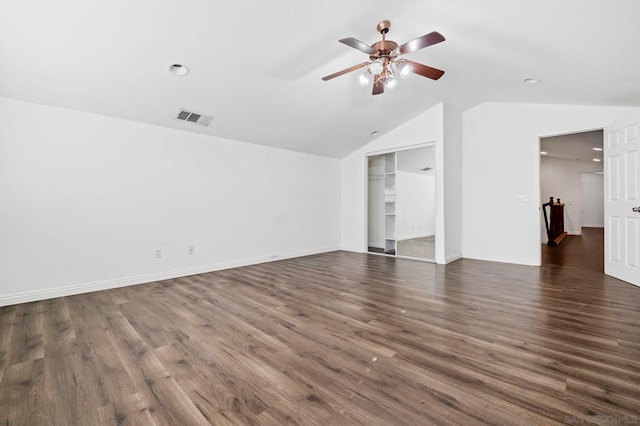 unfurnished living room with lofted ceiling, dark wood-type flooring, and ceiling fan