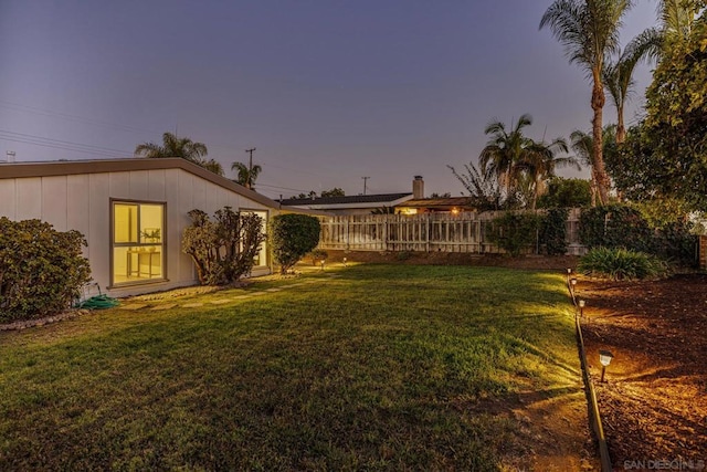 view of yard at dusk