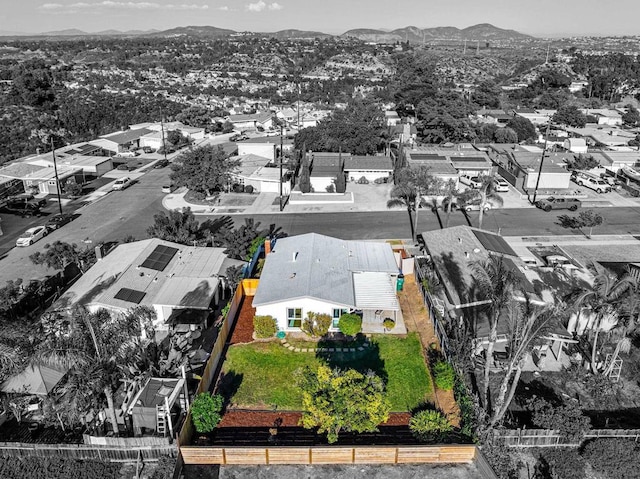 birds eye view of property with a mountain view