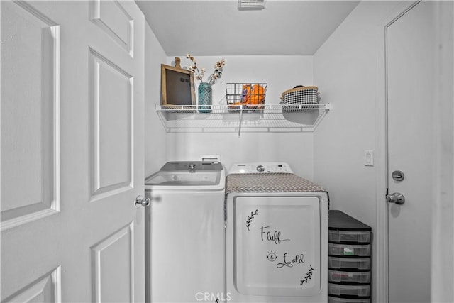 washroom featuring washer and clothes dryer