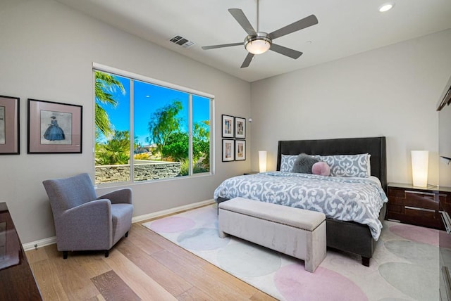 bedroom featuring ceiling fan and light wood-type flooring