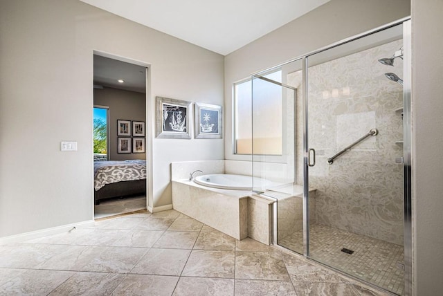 bathroom with tile patterned floors and separate shower and tub