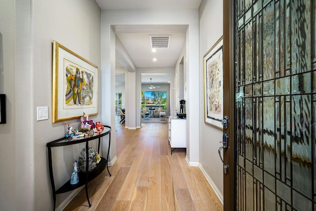 corridor featuring light wood-type flooring