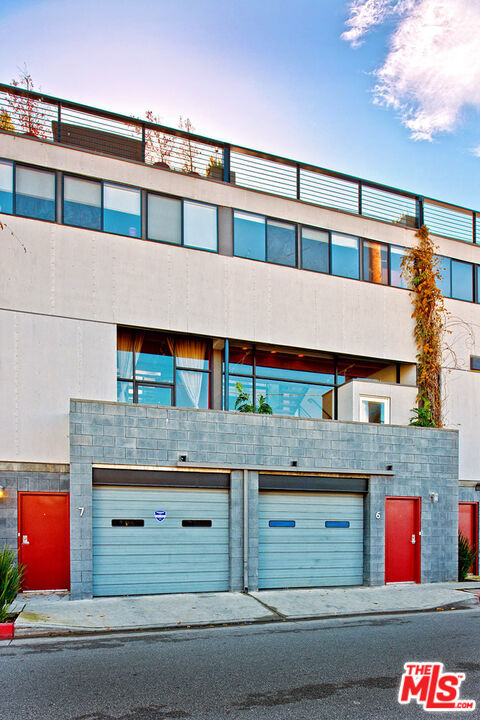 outdoor building at dusk with a garage