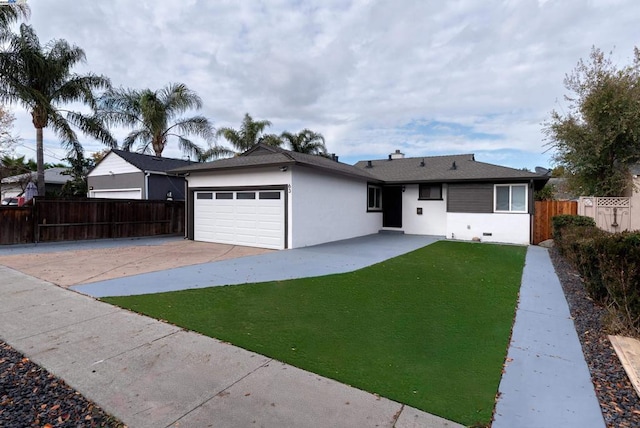 single story home featuring a garage and a front yard