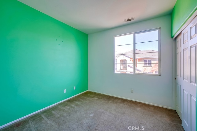 view of carpeted spare room