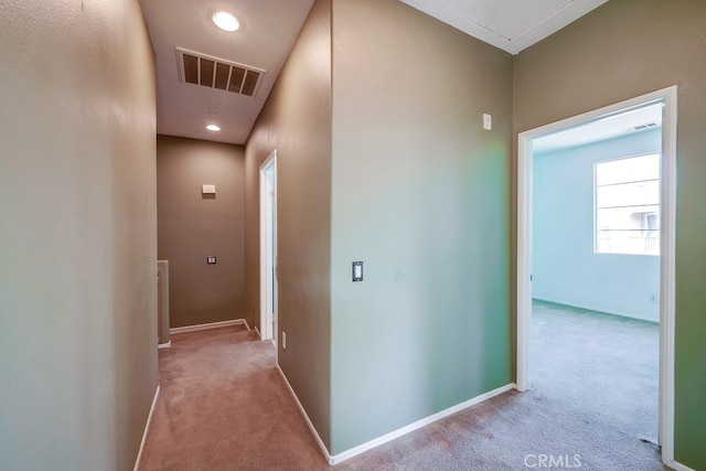 corridor with light colored carpet