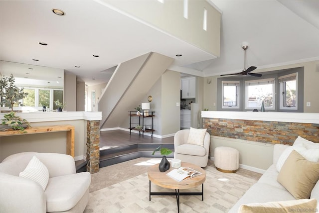 living room featuring lofted ceiling and ceiling fan