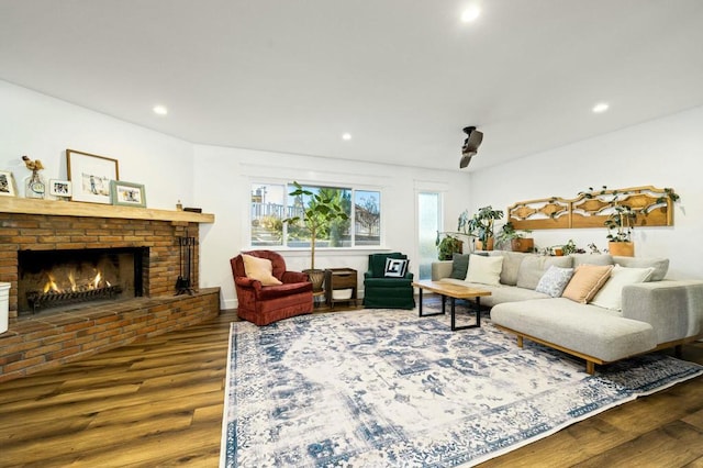 living room with a fireplace and hardwood / wood-style flooring