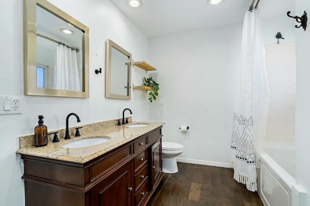 full bathroom featuring shower / tub combo, toilet, vanity, and wood-type flooring