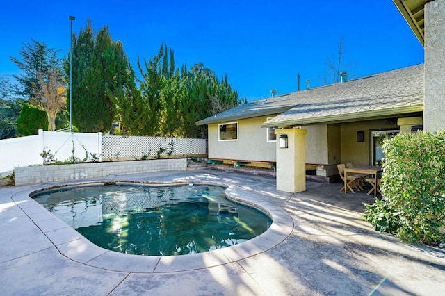 view of swimming pool with a patio