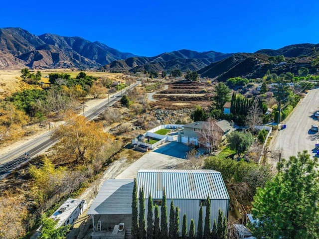 birds eye view of property with a mountain view