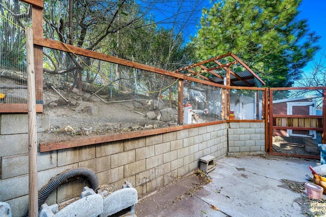 view of patio featuring an outdoor structure