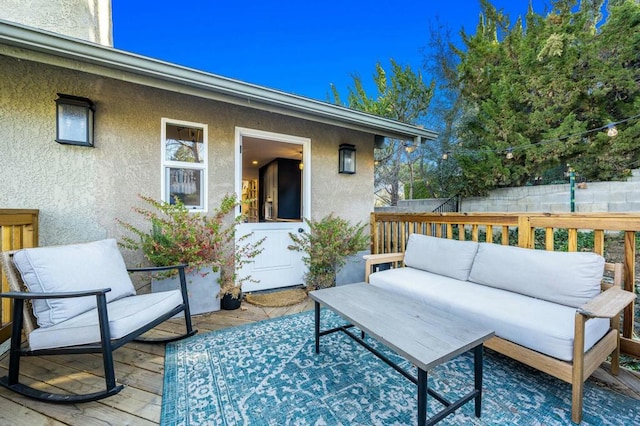 wooden deck with an outdoor hangout area