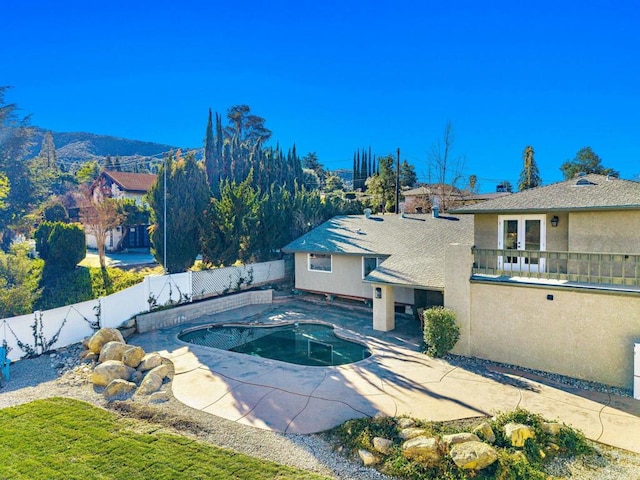 view of swimming pool with a mountain view