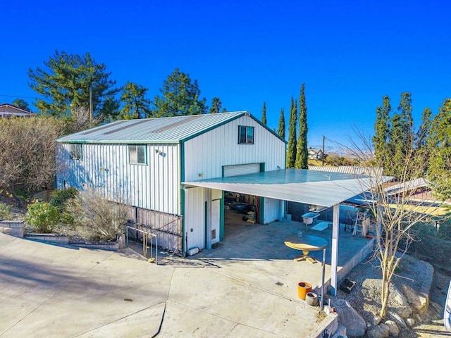 view of outbuilding with a carport