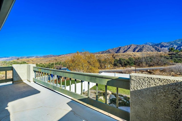 balcony featuring a mountain view