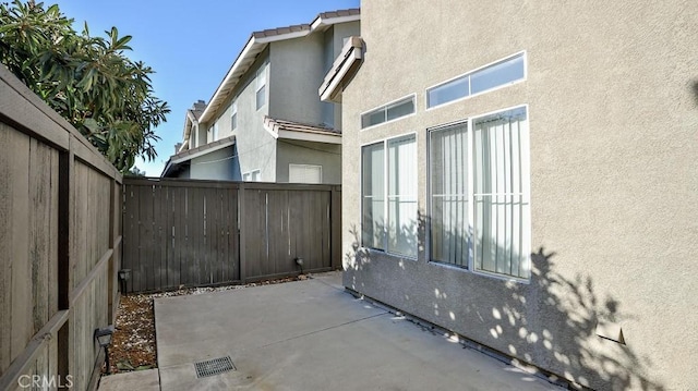 view of side of home with a patio