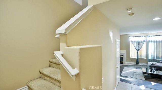 staircase with tile patterned floors