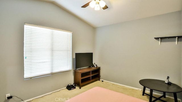 carpeted bedroom featuring lofted ceiling and ceiling fan