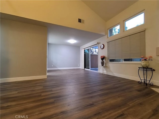 1911 E Calico Dr, West Covina, CA 91791 - unfurnished living room featuring high vaulted ceiling, dark wood-style flooring, and baseboards
