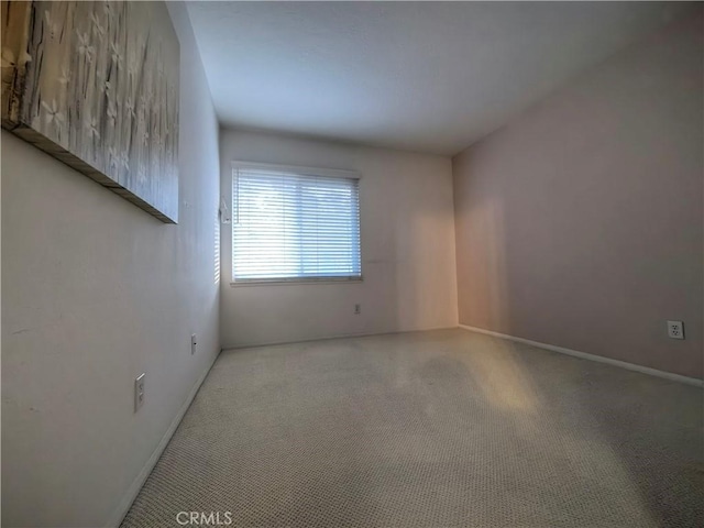 1911 E Calico Dr, West Covina, CA 91791 - spare room featuring light carpet and baseboards