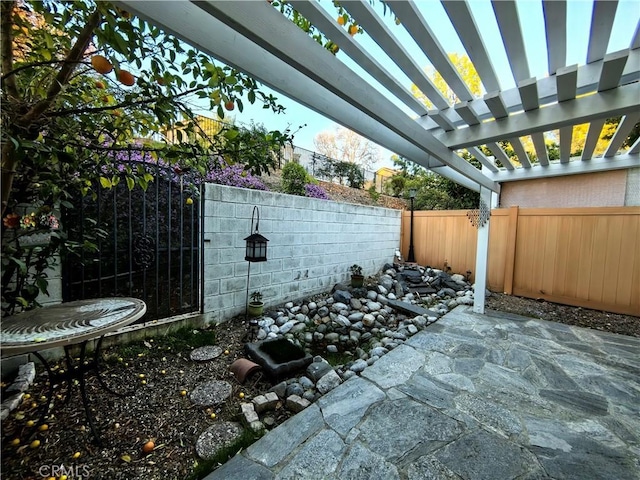 1911 E Calico Dr, West Covina, CA 91791 - view of patio featuring a fenced backyard and a pergola