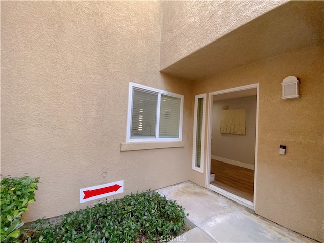 1911 E Calico Dr, West Covina, CA 91791 - doorway to property featuring stucco siding