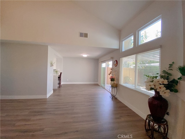 1911 E Calico Dr, West Covina, CA 91791 - living room with high vaulted ceiling, wood finished floors, and baseboards