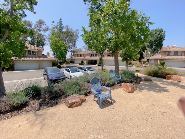 1911 E Calico Dr, West Covina, CA 91791 - view of yard featuring a garage and a residential view