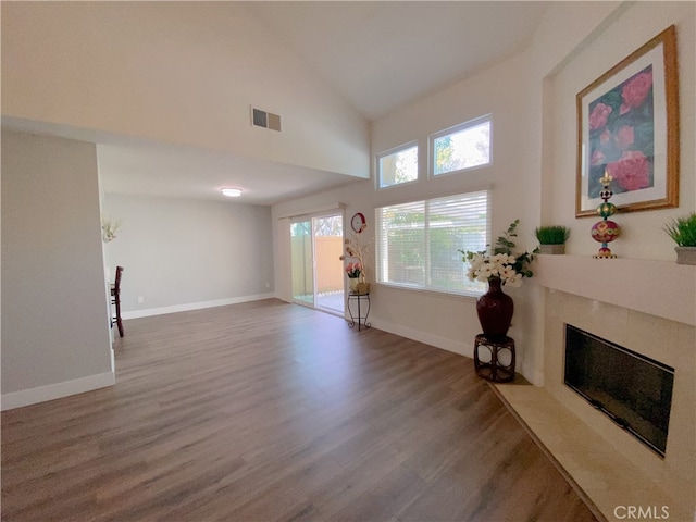 1911 E Calico Dr, West Covina, CA 91791 - living room with wood finished floors, a fireplace, baseboards, and high vaulted ceiling