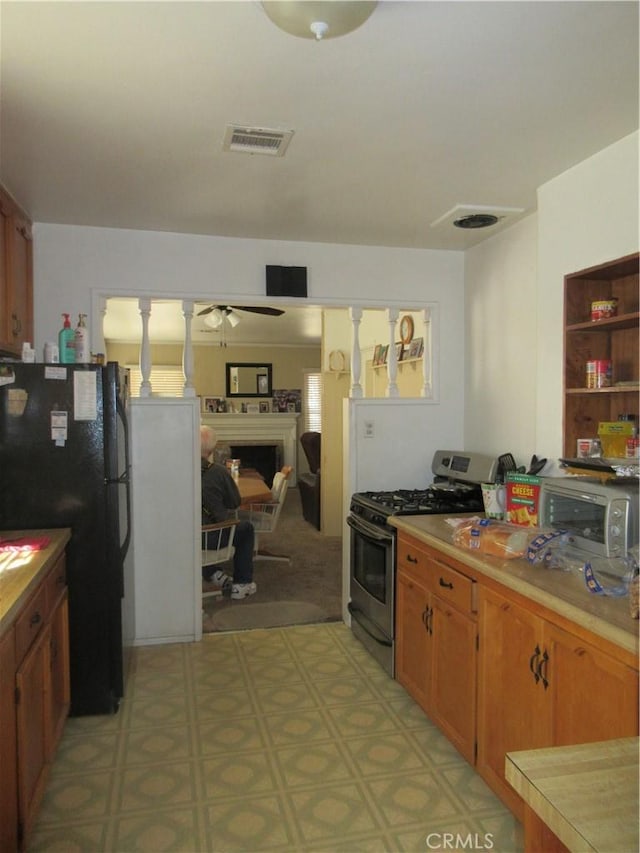 kitchen featuring ceiling fan and appliances with stainless steel finishes